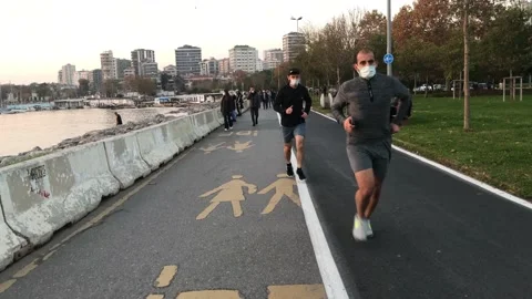 People running on the beach Video stock 144342121