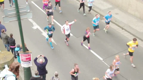 People running at half Marathon event with cheering people in the shot Stock Footage 36990078