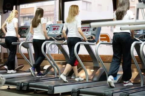 People running on machines, treadmill Stock Photos