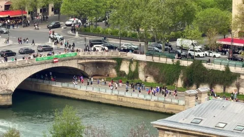 People running a marathon along the Seine river in Paris Stock Footage 337783230