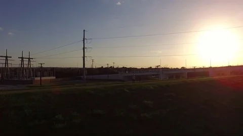 People Running On Path During Sunset Fly Down Tilt Up Stock Footage 76289918