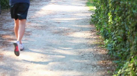 People running on a path at park Stock Footage 8567536