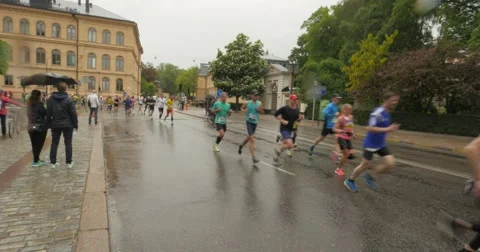 People running in the rain Stock Footage 50571915
