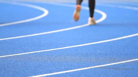People running on the track stadium Stock Footage 76062089