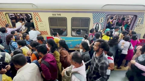 People Rush to Board Local Train at Dadar station in Mumbai city. 4K (Dangerous) Stock Footage 248408572