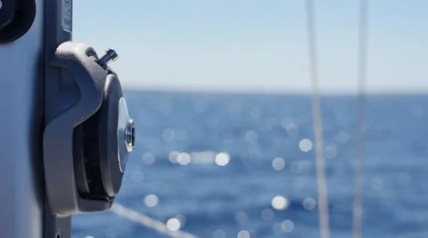 People sailing, man pulling ropes, winding sheets around winches Stock Footage 58107294