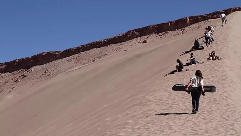 People sandboarding Stock Footage 77047457