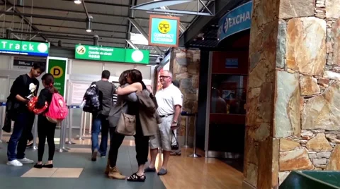 People say goodbay in front of security checkpoint gate Stock Footage 46488443