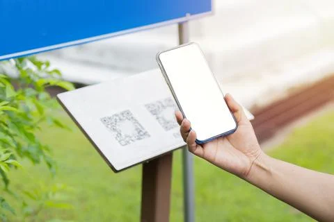 People Scan by QR Code connect to mobile application for information at park. Stock Photos