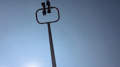 People screaming while riding a rotating catapult attraction in a theme park Stock Footage 88799479