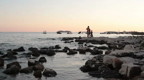 People on sea rocks Stock Footage 40664839