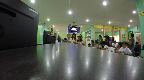 People seated in queue in government office Stock Footage 54568188