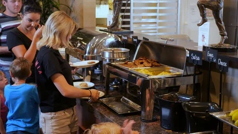 People serving from breakfast buffet line Stock Footage 94238154