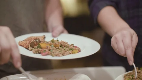 People serving food for themselves Stock Footage 87808865
