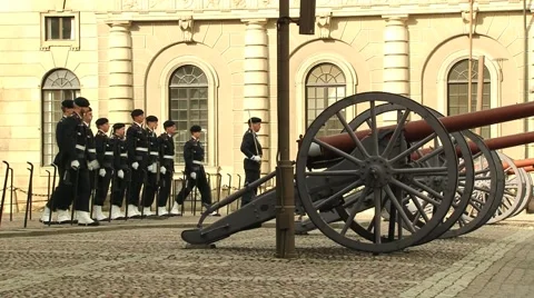 People serving as royal guards walk by the square in Stockholm, Sweden. Video stock 61166210