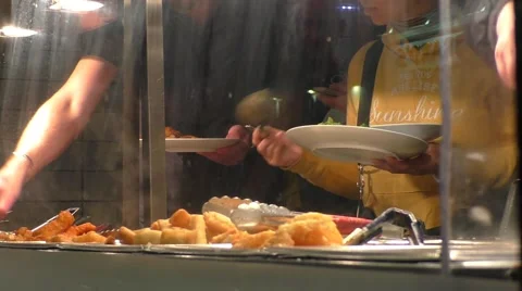 People serving themselves at Chinese Buffet Restaurant Stock Footage 46941422