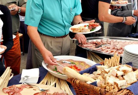 People serving themselves during a buffet Foto stock
