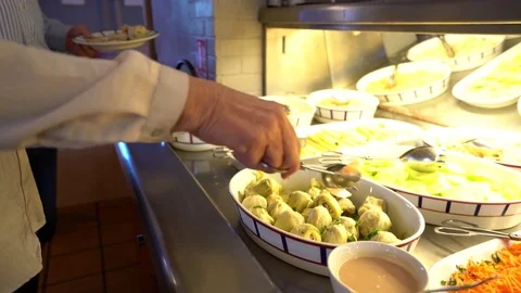 People serving themselves in restaurant buffet Stock Footage 72137950