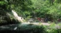 People at seven-tiered Erawan Waterfall in Erawan National Park, Thailand HD Footage