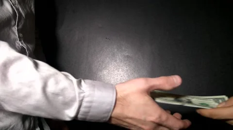 People share with each other a bundle of dollars on a bunch of keys Stock-Footage 68375258