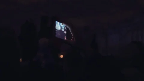 People shoots 3D mapping light show on a mobile phone. Stock Footage 82240738
