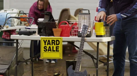 People shop at yard sale Stock Footage