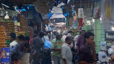 People shopping in a congested bazaar located in narrow lane in Mumbai Stock Footage 329098767