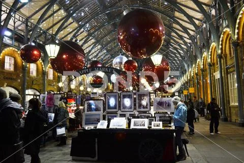 People shopping at the Covent Garden Apple market decorated for Christmas. Stock Photos