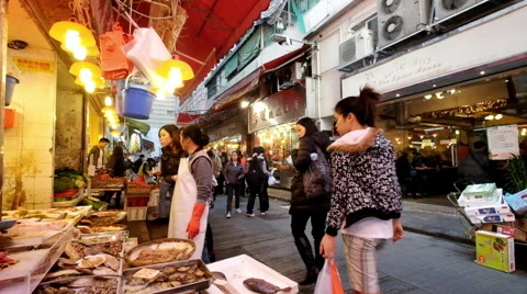 People shopping seafood on the traditional asian street market. Hong Kong Stock-Footage 59797992