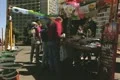 People shopping at street stall Footage