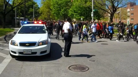People show unity during a peace march in Baltimore, MD. Video stock 62533650