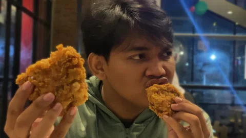 People showcasing a crispy chicken close up 4k footage Stock Footage 272623629