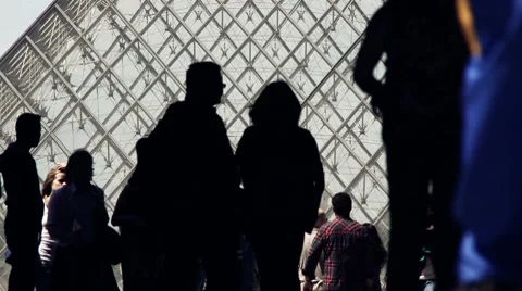People silhouetted in front of the Louver pyramid Stock Footage