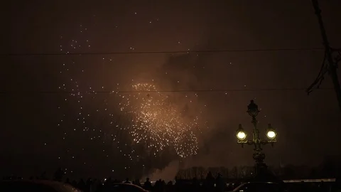 People silhouettes on the bridge watching fireworks Stock Footage