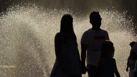 People silhouettes at the waterwork Stock Footage 77011466