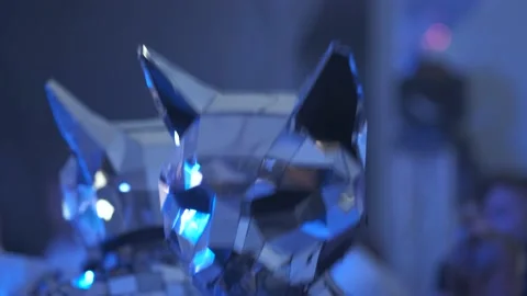 People in silver-colored mirrored cat costumes dance with guests at the party in Video stock 162304907
