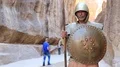People in Siq - gorge that leads to Red Rose City Of Petra in Jordan HD Footage