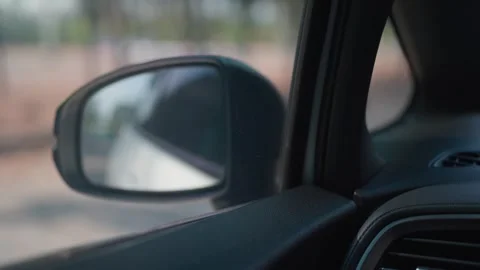 People sit and watch the view from the side window of a speeding car along the h Stock Footage 264105366