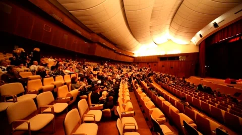 People sit in auditorium for watching performance of hypnotist Stock Footage
