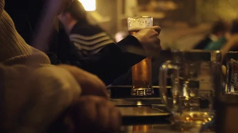 People sit in the evening in the pub and drinking beer. Stock Footage 71674032