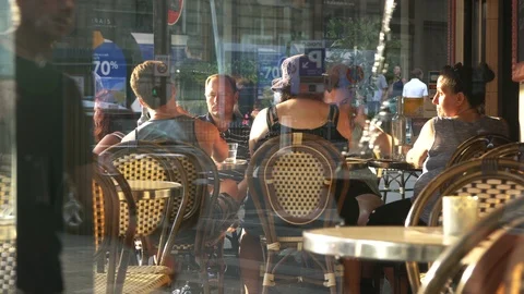 People Sit Relax by Table of Cozy Street Cafe Stock Footage 116834099