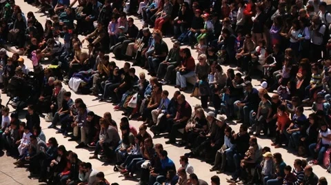 People sit in rows enjoying show in Montblanc, Spain. Video stock 61753640