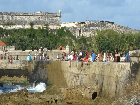 People sit on the seafront Stock Footage 70990920