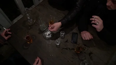 People sit at the table, drink vodka Stock-Footage 99275800