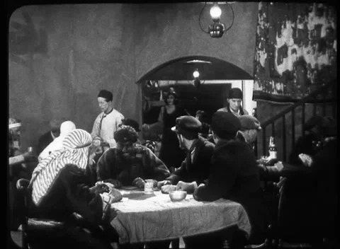 People sitting around table and talking to each other, United Kingdom, 1923 Video stock 172219378