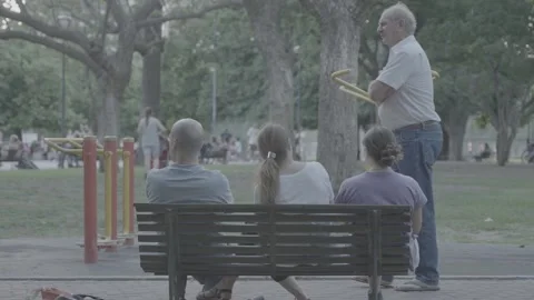 People sitting on a bench in a park in Buenos Aires, Argentina Stock-Footage 345138067