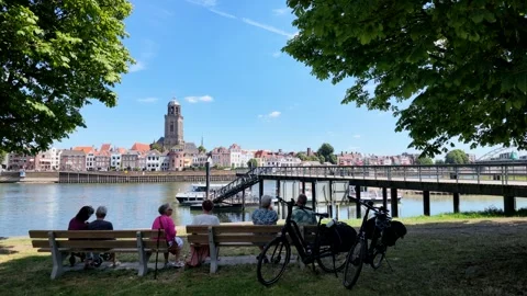 People Sitting On A Bench Under A Tree In The Shade On A Hot Summer Day Stock Footage 340916753