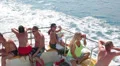 People sitting on deck of recreational marine ship. Floating in Mediterranean HD Footage
