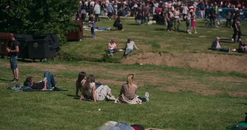 People Sitting on Grass During Public Event in Maksimir Park 動画素材 336029180