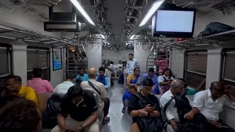 People sitting inside a moving train carriage during their daily commute Stock Footage 336705017